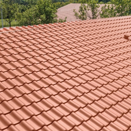 Erlus AG E58 RS low pitch roof tiles featured in a red colour for low pitch roofs