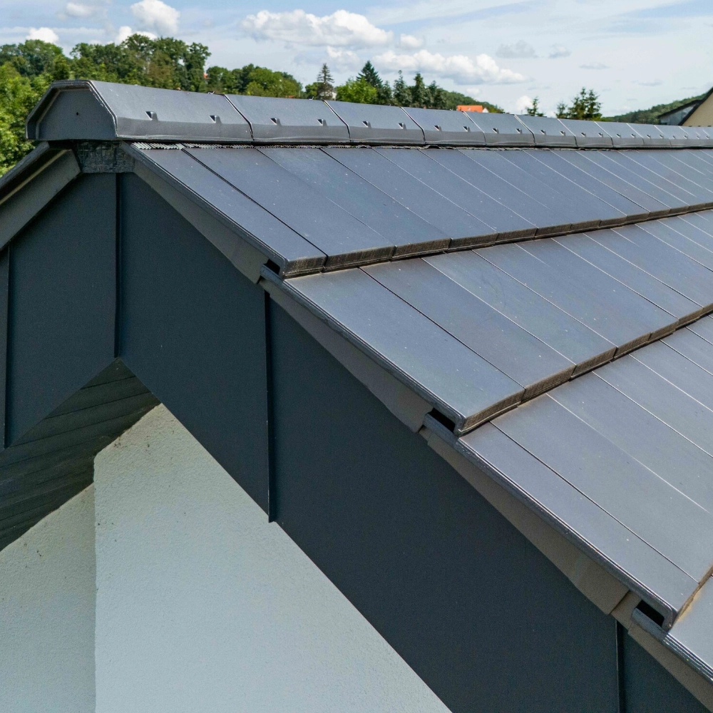 Erlus AG Level RS low pitch roof tiles featured in a dark grey colour for low pitch roofs
